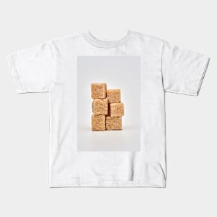 Closeup of brown sugar cubes on white Kids T-Shirt